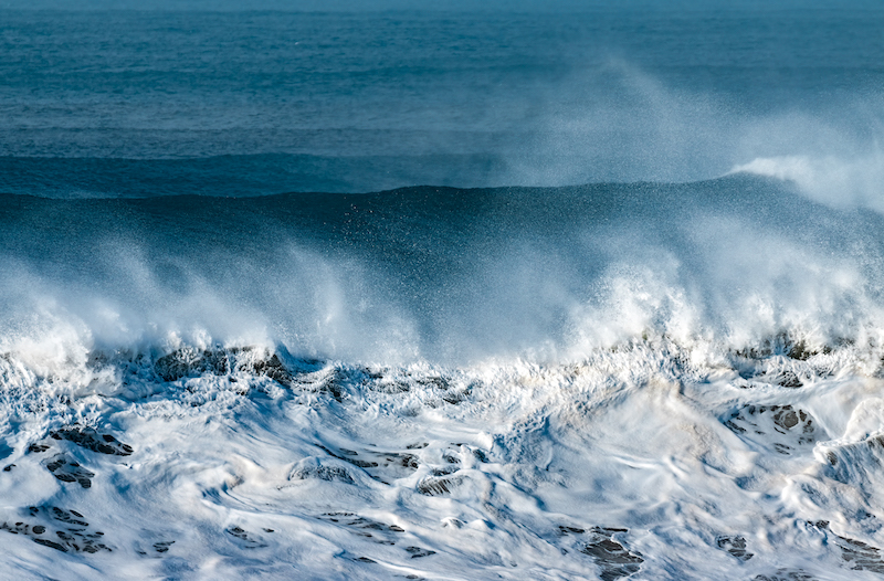 The seascape with huge waves in stormy weather