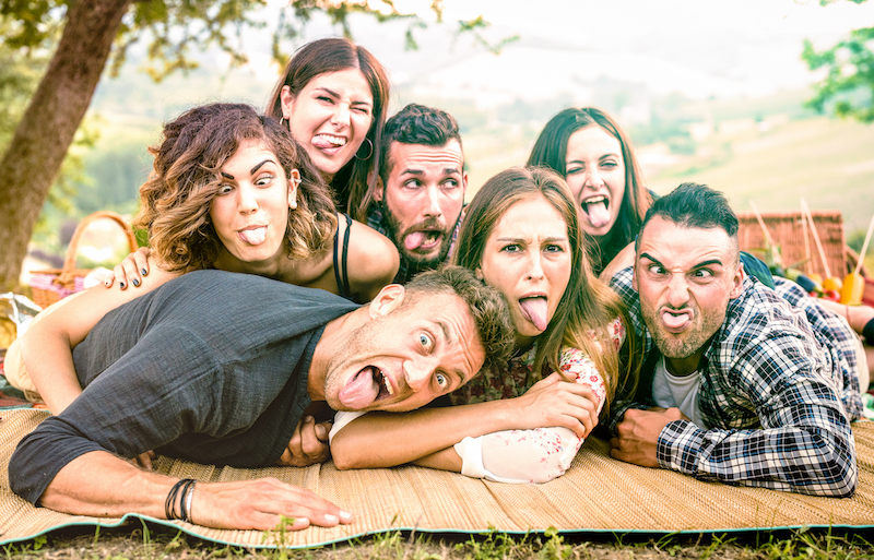 Friends taking selfie with funny faces