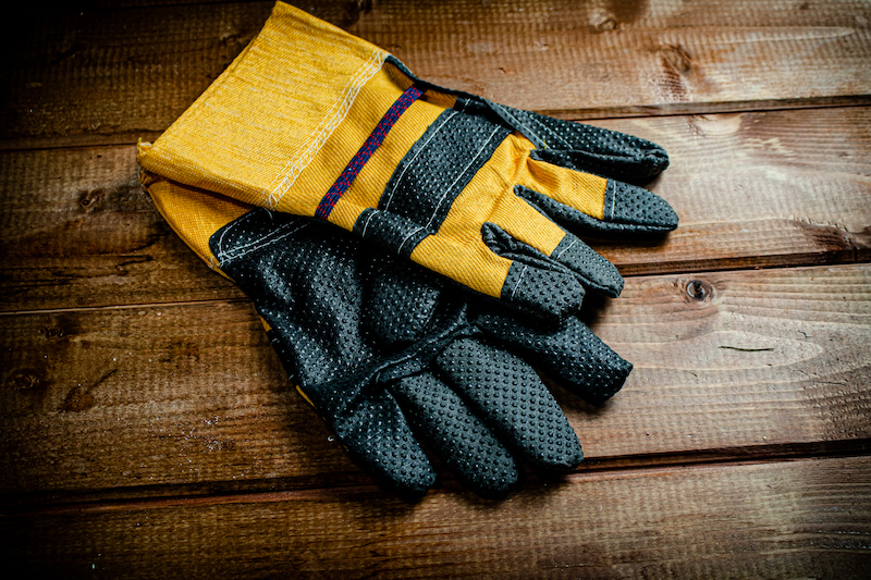 A pair of construction gloves on the table.