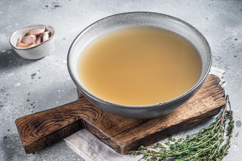 Bone meat chicken broth in a plate. 