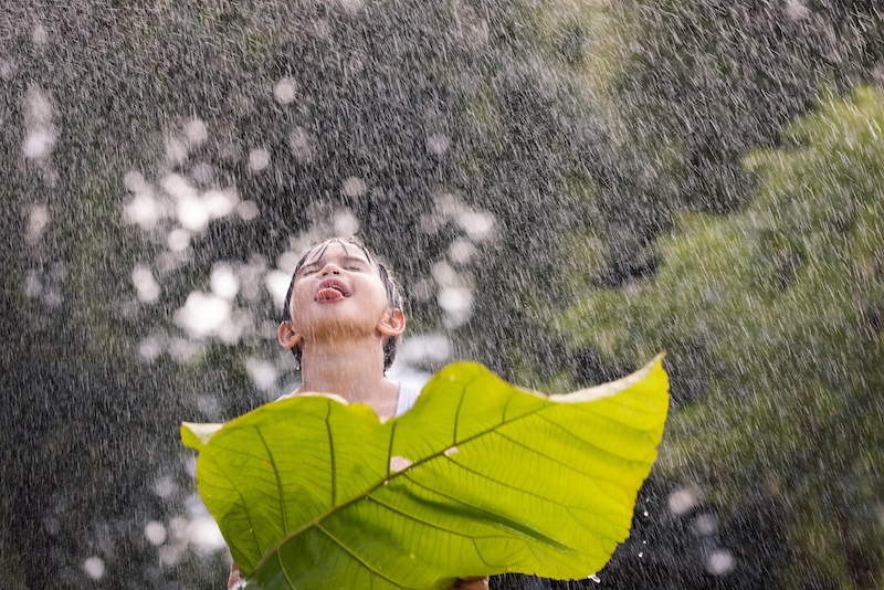 boy licking rain