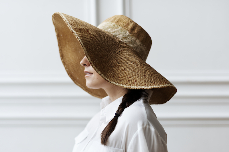 Woman in a vintage wide brim summer hat