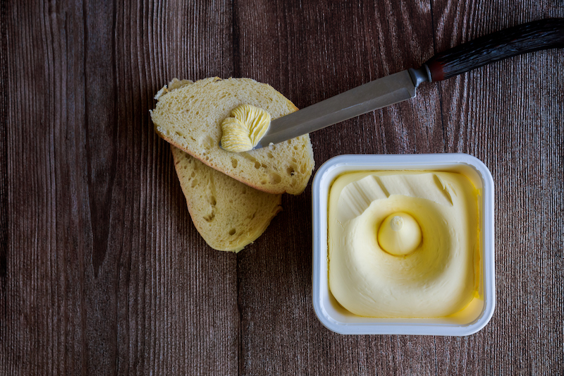 Creamy butter spread on a slice of bread.