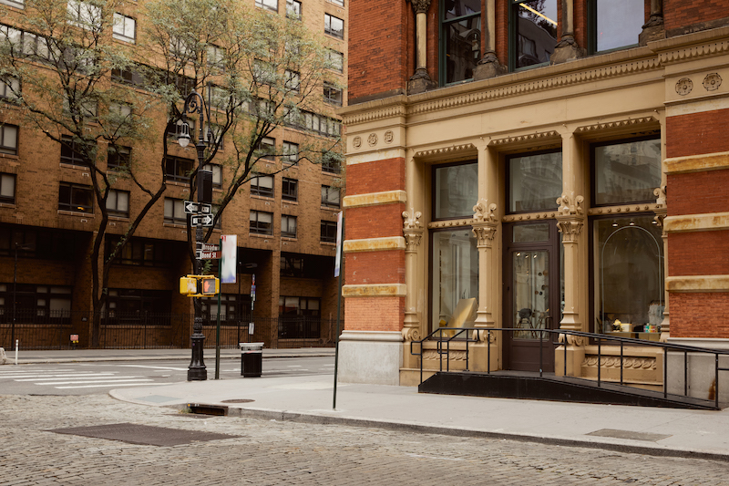 red brick budlings and autumnal trees on crossroad in downtown of new york city, streetscape