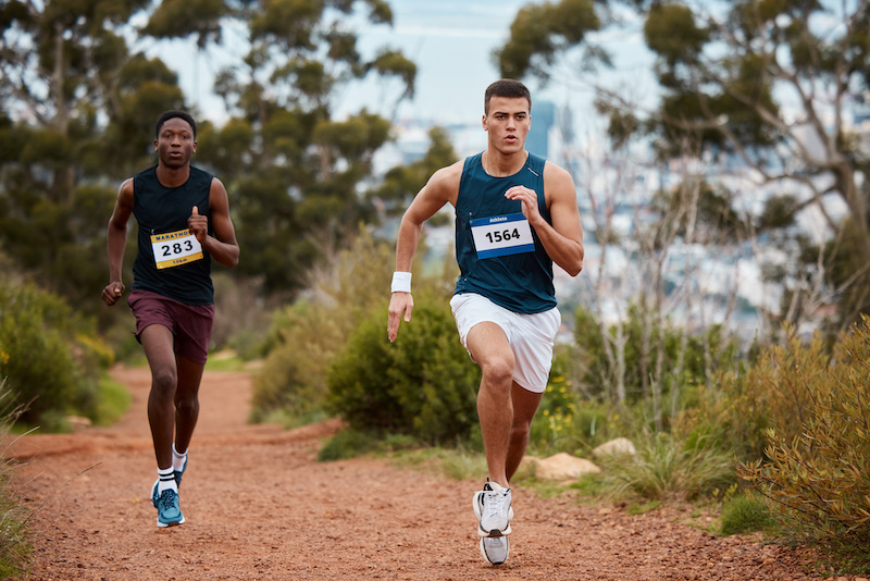 Marathon, race and people running in nature for fitness competition or sports challenge.