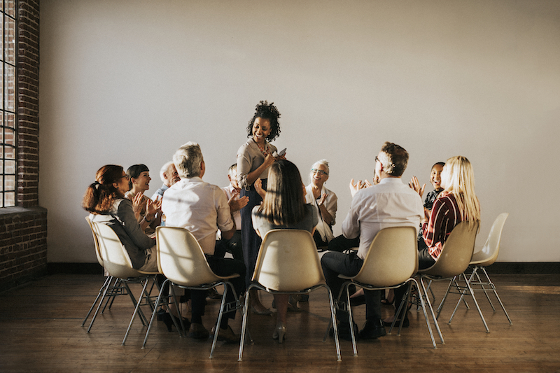 People sitting and talking with a group