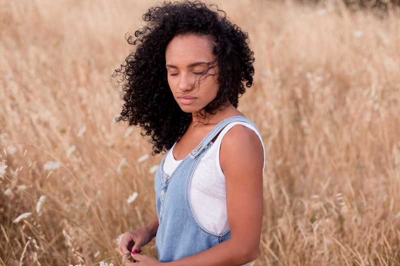 beautiful young afro american woman at sunset