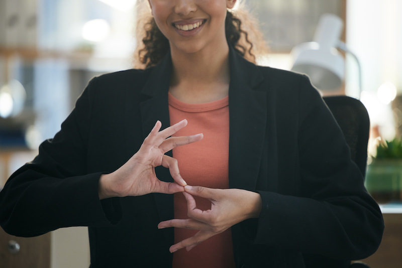 woman using sign language