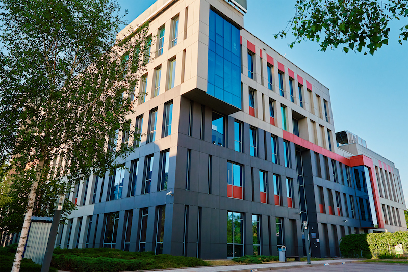 Facade of buiding with green trees